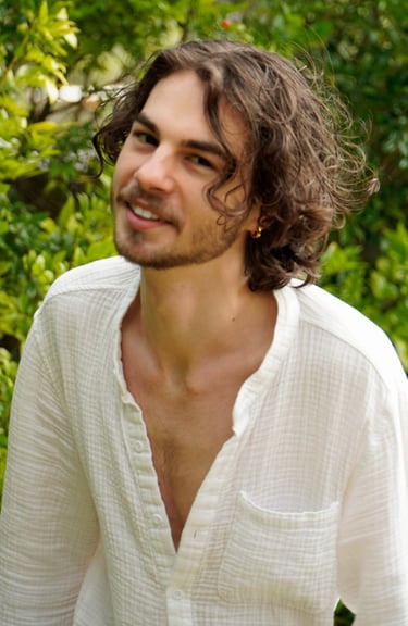 a man with a beard and a white shirt