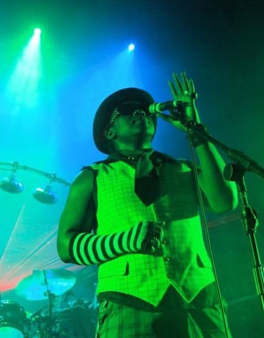 singer onstage holding microphone