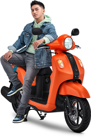 a man sitting on a scooter in a blue jacket
