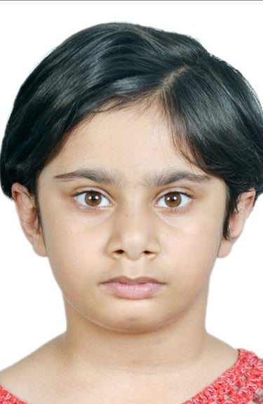 a young girl with a red shirt and a red sweater