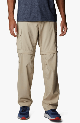 a man in a blue shirt and tan pants