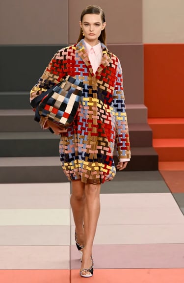 Fendi Spring Summer 2026 runway – colourful woven oversized coat with matching bag.