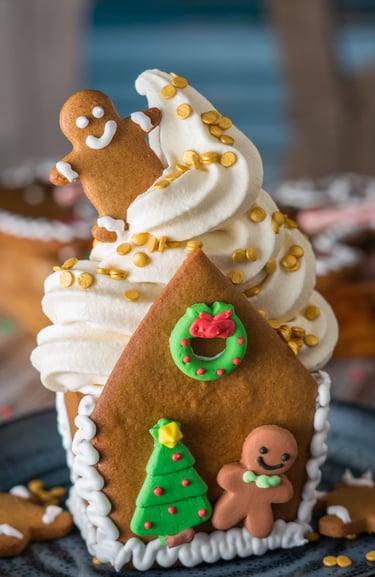a gingerbread house with soft serve inside 