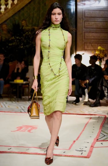 Versace Spring Summer 2026 – Lime ruched dress with bold jewelry.