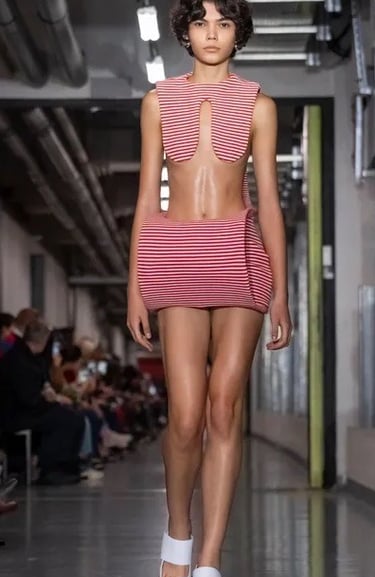 Jean Paul Gaultier SS26 – Sculptural striped mini look.