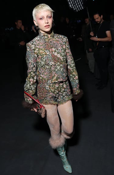 Emma Chamberlain at Paris Fashion Week 2026 in floral outfit.