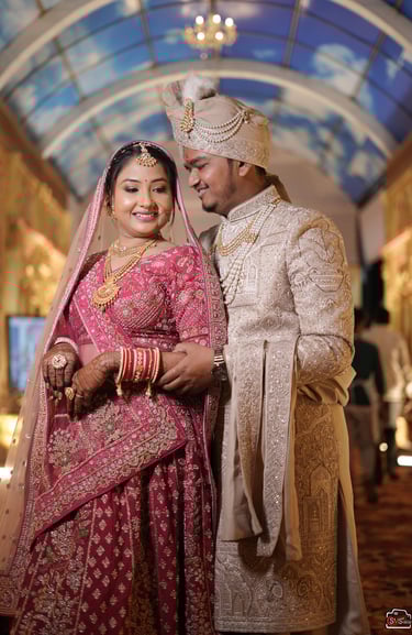 “Traditional red and gold Indian bridal makeup with flawless HD base and classic red lips in Vadodar