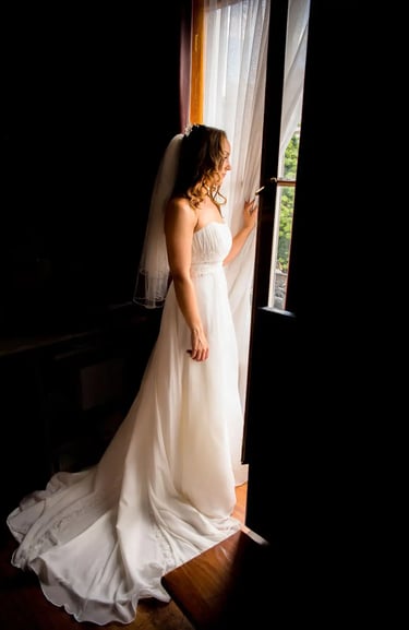 bride looking out of a window 