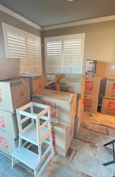 Organized moving boxes packed and labeled for a residential move