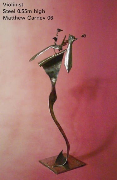 a sculpture of a woman playing a violin