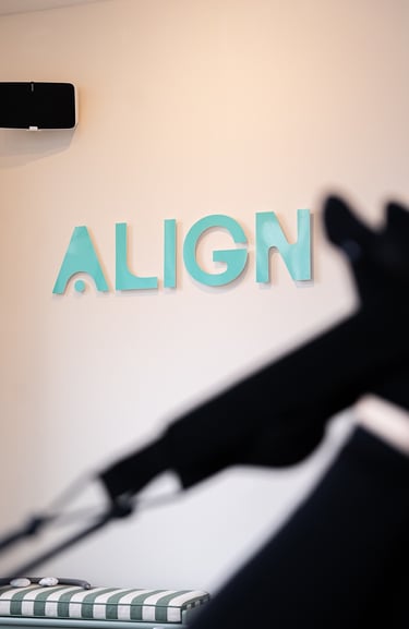 sign align in turquoise on the wall