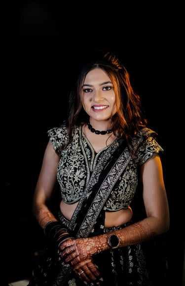 Beautiful Indian bride in black lehenga choli with detailed bridal makeup, flawless base, bridal hai