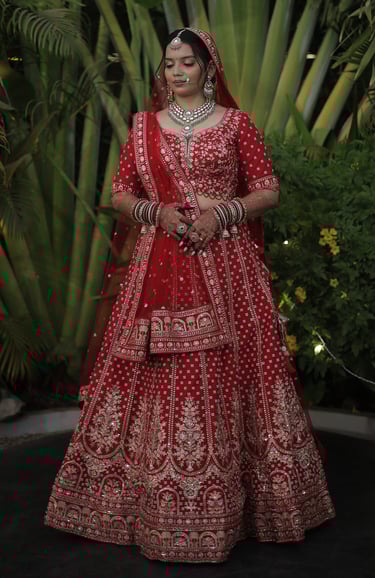 Vadodara Gujarati bridal makeup in red lehenga with jewellery, wedding photoshoot portrait