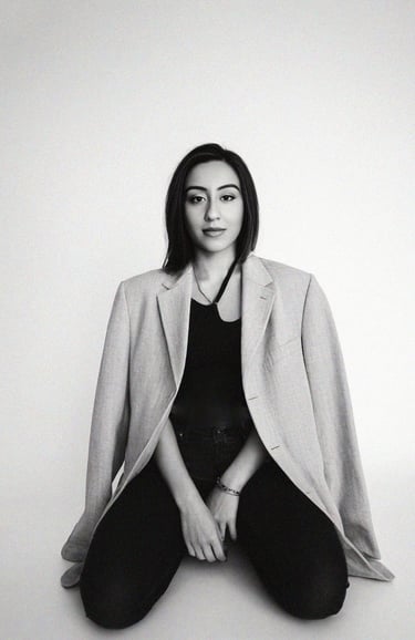 a woman sitting on a chair with her legs crossed