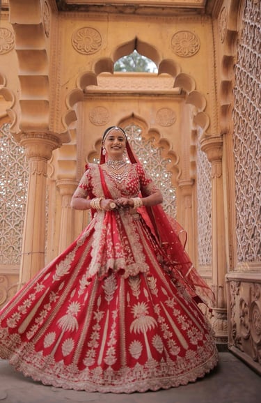 Full length red bridal lehenga with professional wedding makeup in Vadodara