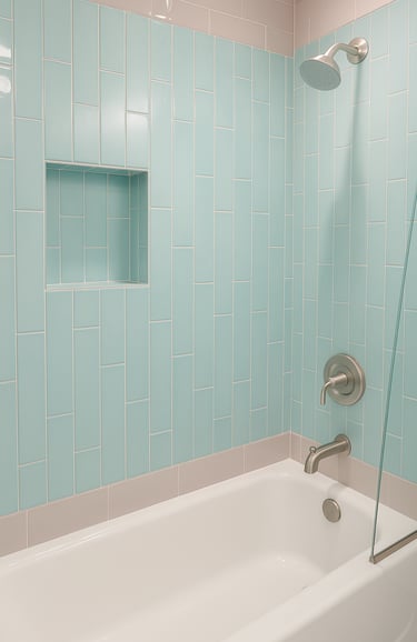 renovated shoer and bath with blue and grey tiles
