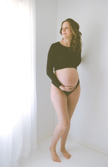 maternity photo taken in Adelaide studio, mother looking out the window