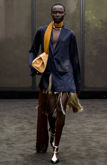 Ferragamo navy blazer and gold fringe skirt with mustard scarf – Spring Summer 2026.