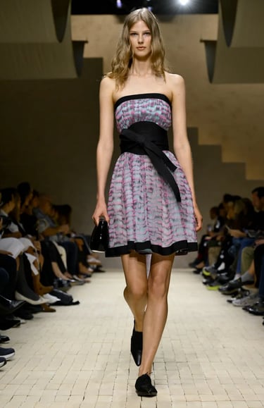 Armani Spring Summer 2026 – Strapless printed mini dress with bow belt.