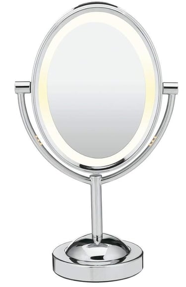 a mirror with a lighted up makeup mirror