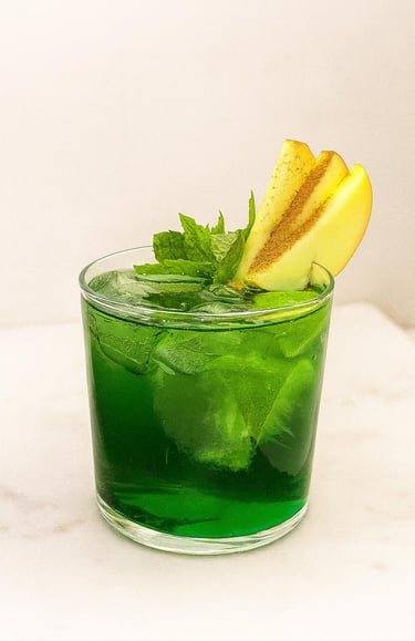 Green Apple cocktail with mint garnish served by mobile bar hire for events