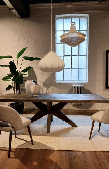 a dining room with a table and chairs