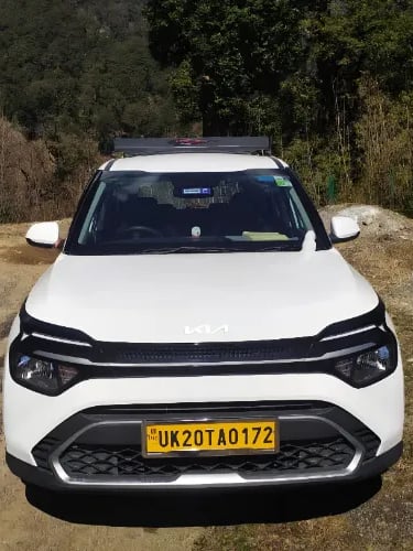 Kumaoni tour & travels Kia Crens Taxi