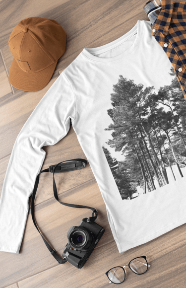 Camera, hat, long sleeved t shirt with nature design on it, glasses  