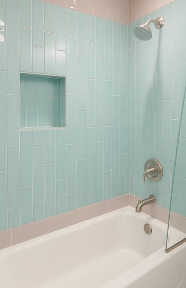renovated shoer and bath with blue and grey tiles