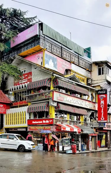 McLeod Ganj square with cafés and local shops.