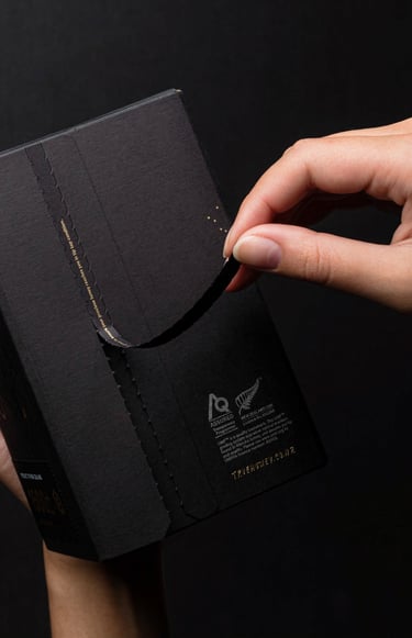 Product photography - a person holding a black box of honey