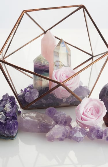 a glass box with a candle and a candle holder