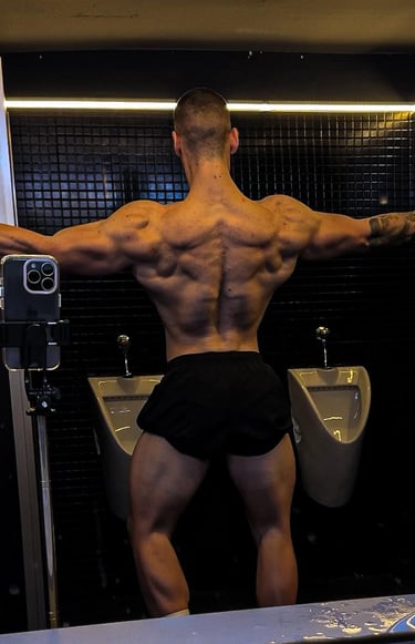 a man in a black underwear suit with a muscular body