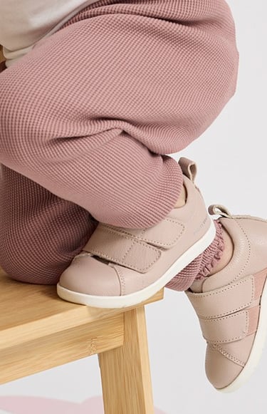 Fashion campaign photography - baby's feet on a wooden chair