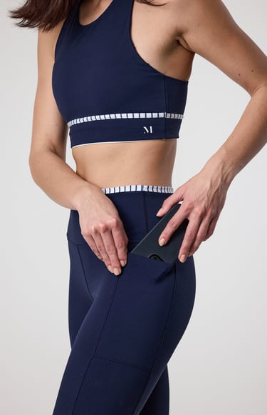 Fashion e-commerce photography - a woman in a sports bra top and leggings