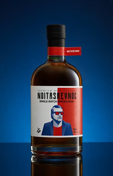 Product photography - a bottle of whiskey with a man in a suit and sunglasses on it