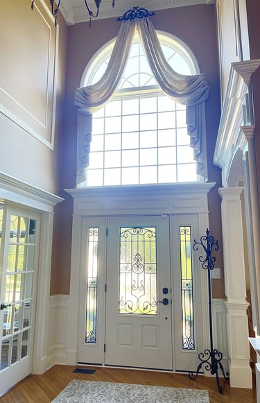 Custom crown molding, columns, and architectural trim in a two-story Monmouth County NJ foyer