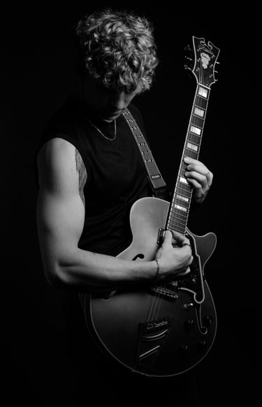 portrait of a man with a guitar and a guitar