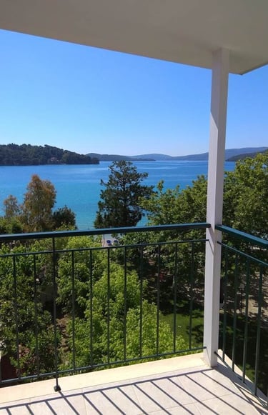 a balcony with a view of the ocean