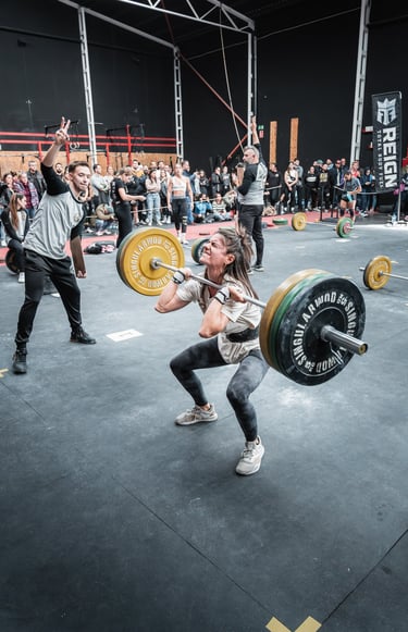 a woman is doing a squat - lift in a gym