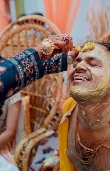 a man with a beard and a woman with a yellow face paint on his face