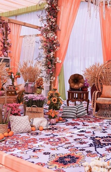 a decorated wedding ceremony with a large floral arrangement