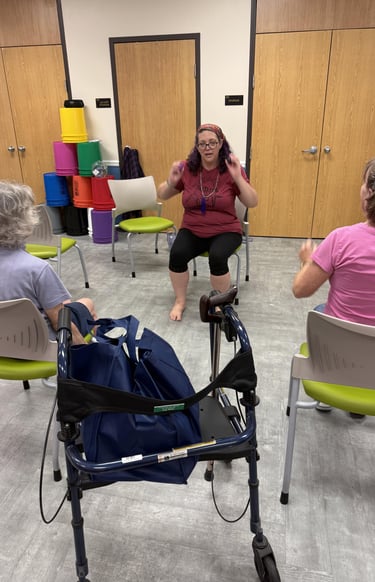 Rachel teaching gentle chair yoga class at Micco library