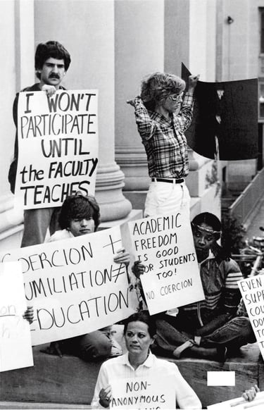 a group of people holding protest signs