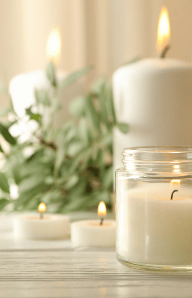a candle with candles and candles on a table