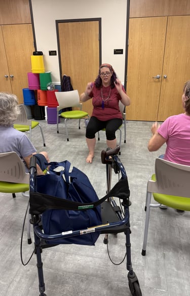 Rachel teaching gentle chair yoga class at Micco library
