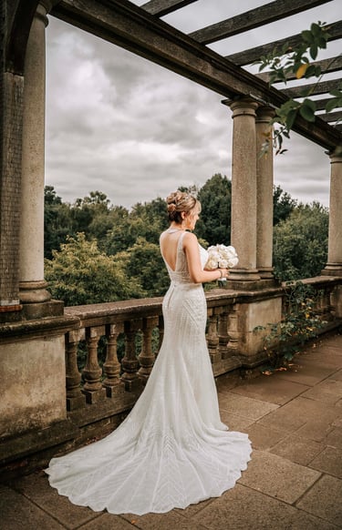 Bride in elegant backless wedding dress captured by Fred Art Studio in London garden