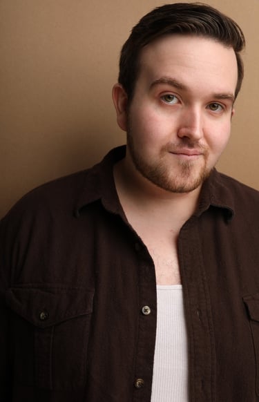 Cade MacFee actor headshot on a brown background