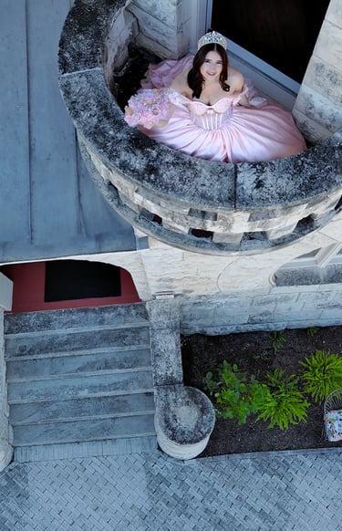 a woman in a pink dress sitting in a boat