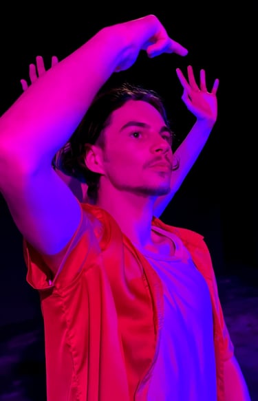 a man in a red shirt and a red capelet